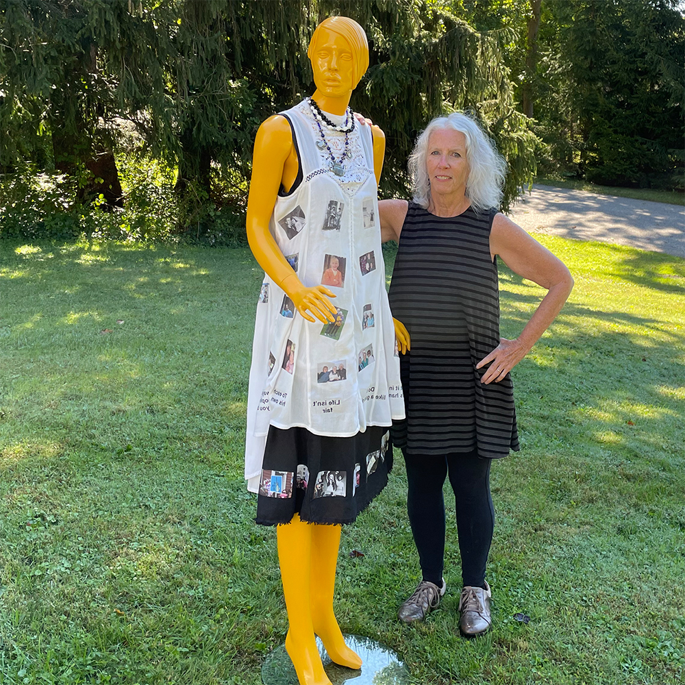 finished mannequin on front lawn with myself wearing black dress and leggings